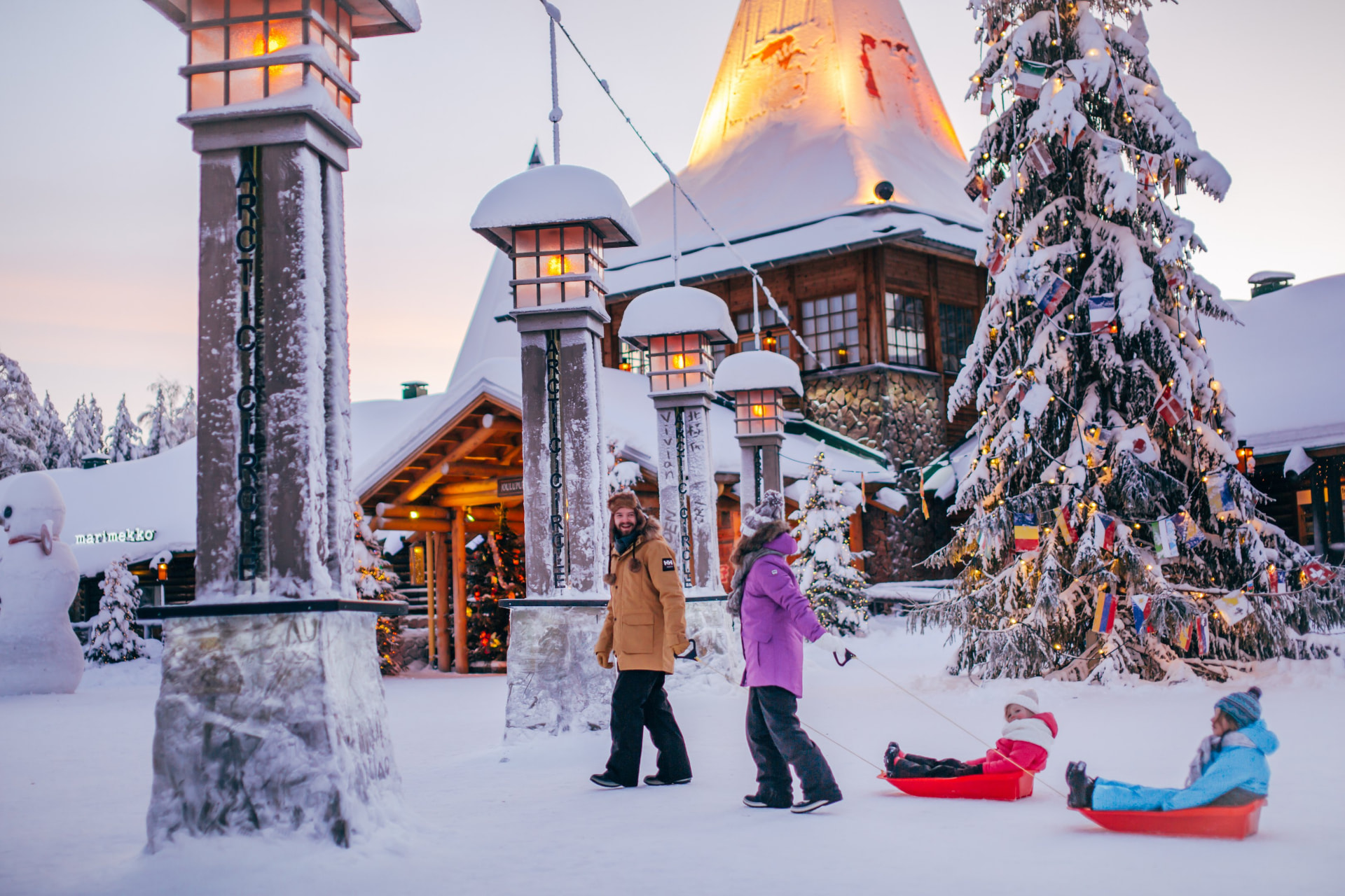Guests crossing the Arctic Circle line at Santa Claus Village